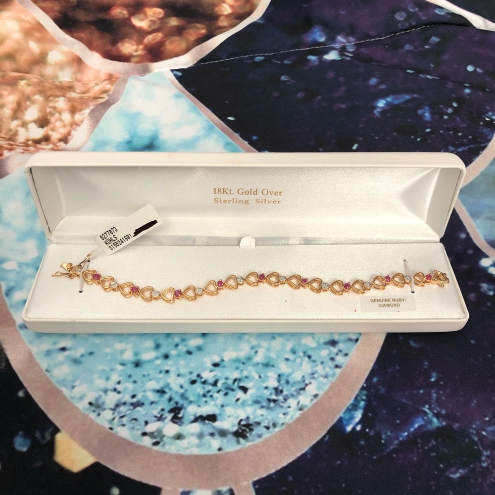 18 Kt. Gold bracelet w/ ruby diamonds